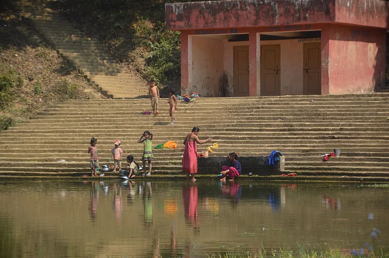 দেবতা পুকুর, খাগড়াছড়ি — Tribal people swimming and bathing view at Debotar pukur